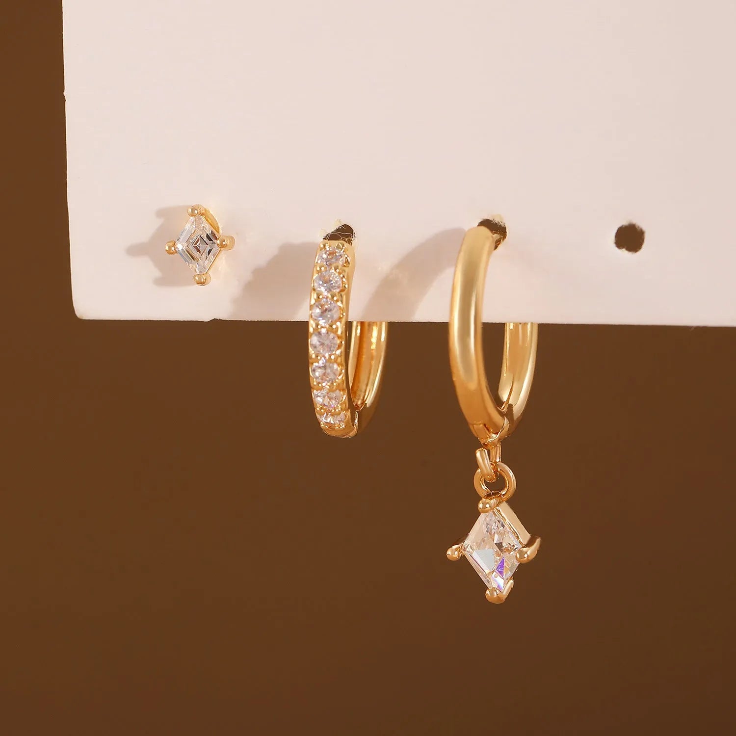 Geometric zircon earring three-piece set with rhombus designs in gold and white copper