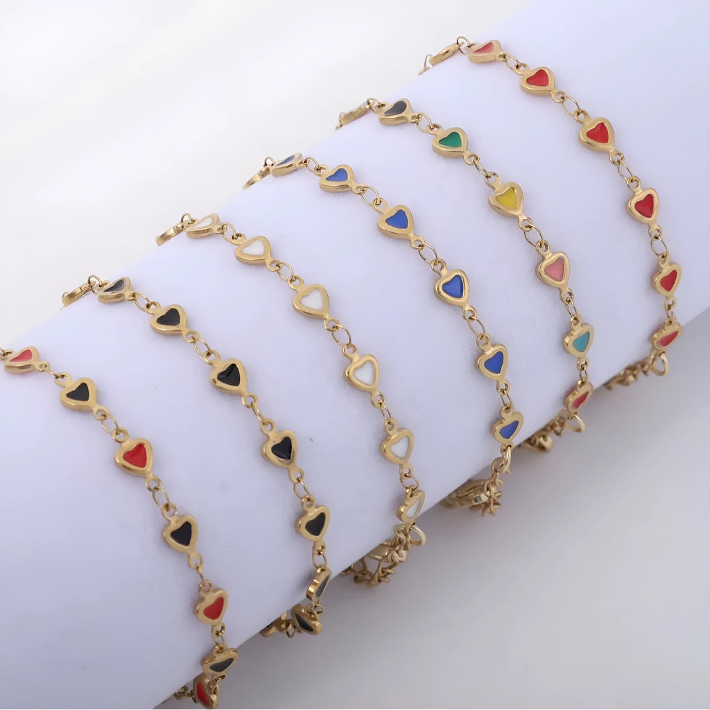 Stainless steel adjustable bracelet with a heart charm, shown in gold colour plating.