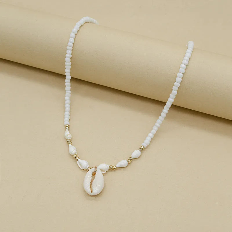 White conch shell necklace with mother of pearl pendant on regular chain, electroplated finish