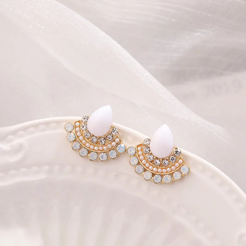 Women's retro fan-shaped alloy earrings with silver stud finish and opal rhinestone detail.