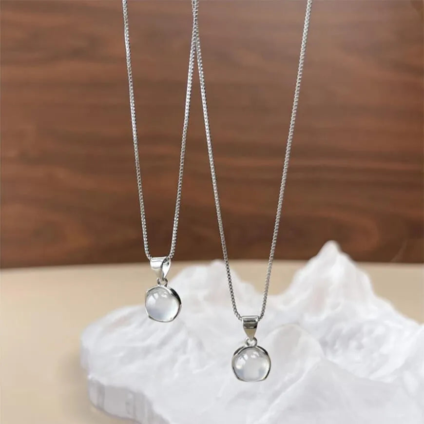 Korean-style oval pendant necklace with geometric crystal design on adjustable box chain