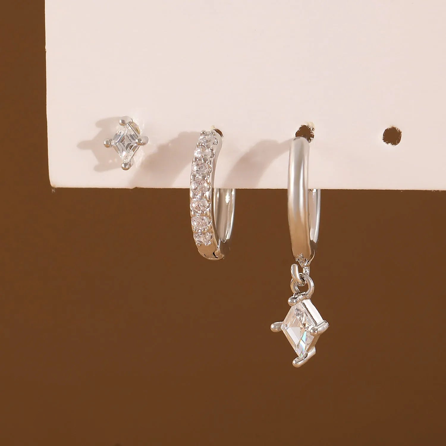 Geometric zircon earring three-piece set with rhombus designs in gold and white copper