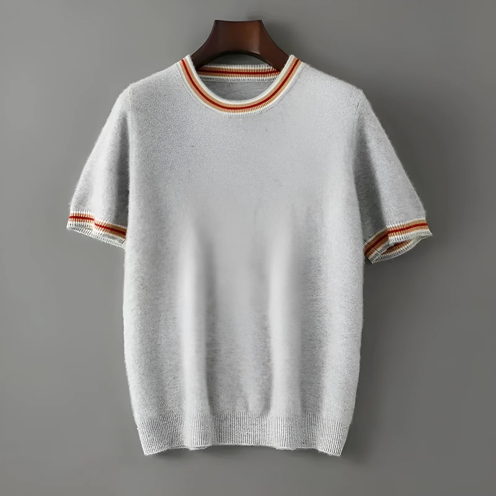 Men's grey short sleeve wool sweater with a round neck on a hanger.