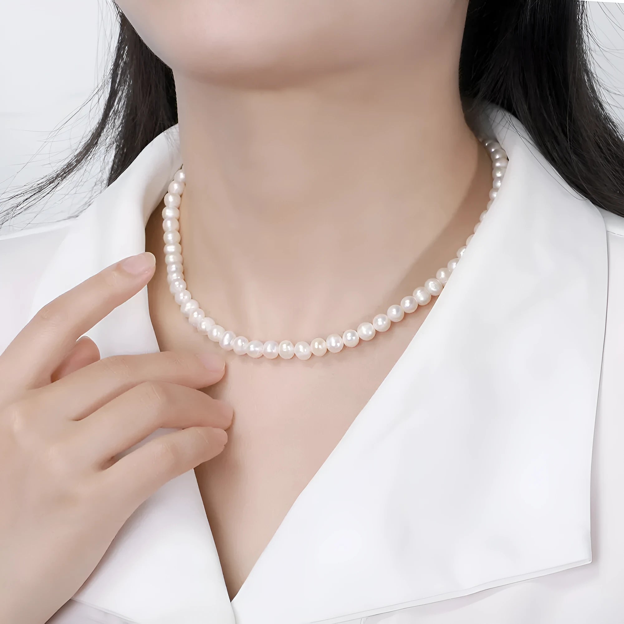 Women's silver adjustable necklace with a single natural freshwater pearl centre.