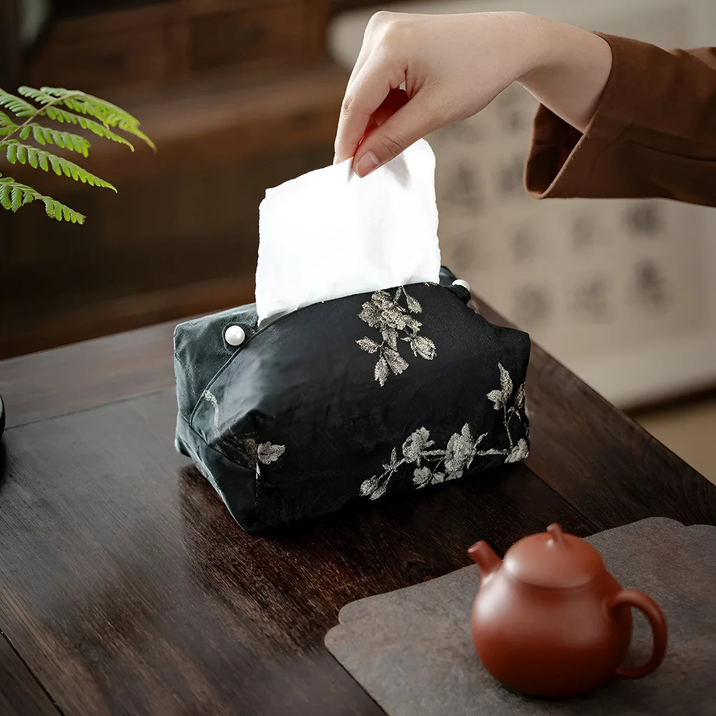 White Chinese brocade tissue box cover with embroidered plum design and optional pearl buckle.