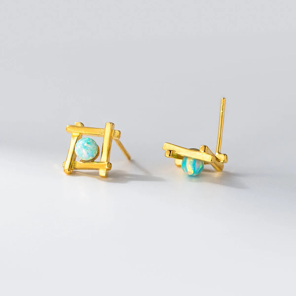 Women's geometric cross quadrangle stud earrings in 925 silver with butterfly clutch closures