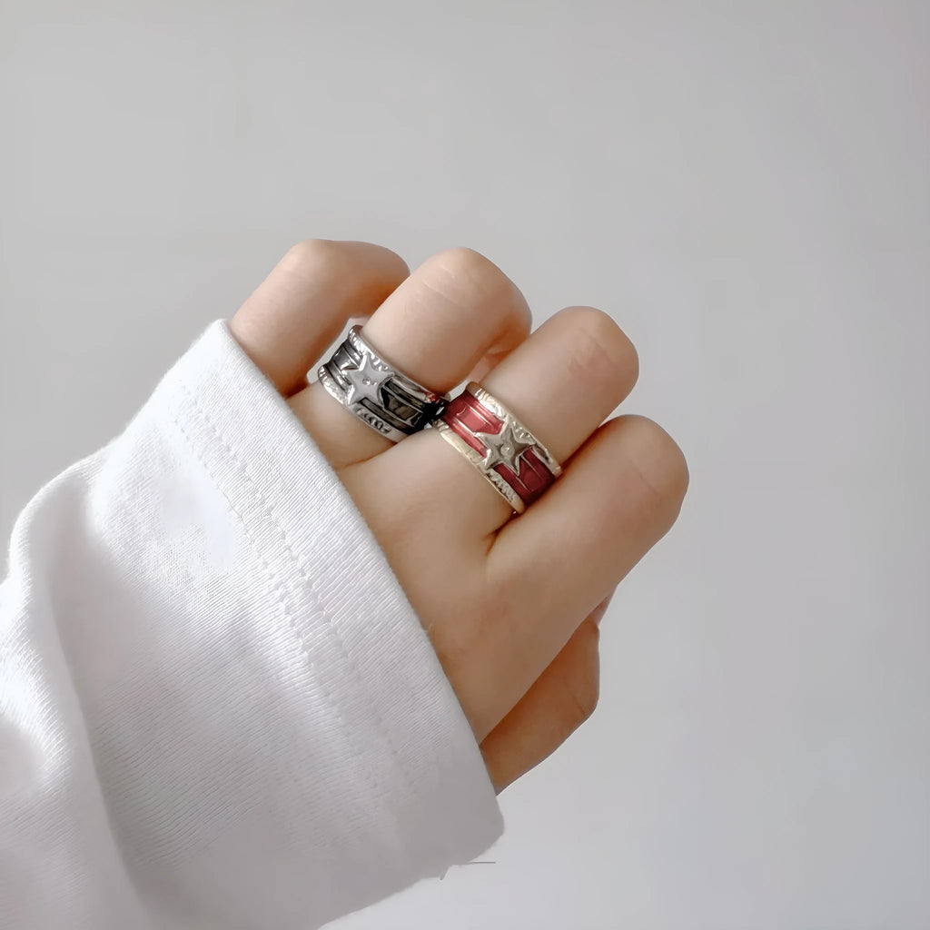 Adjustable geometric drop oil copper ring with a distressed finish in multiple colours.