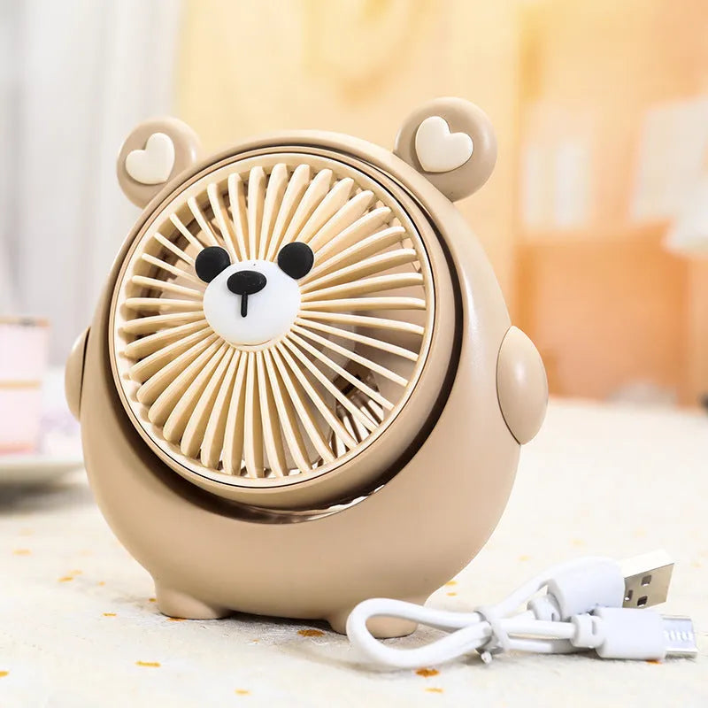 Cute dog-themed USB desktop electric fan on a desk, showing brown puppy colour variant.