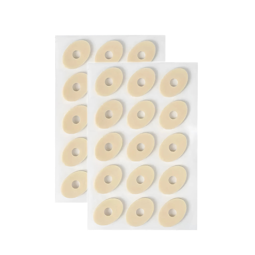 Pack of women's heel corn protectors showing large oval, small oval, U-shaped, and circular section PU pads.