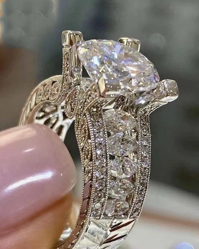 Geometric women's alloy ring with round details in gold or white electroplated finish.