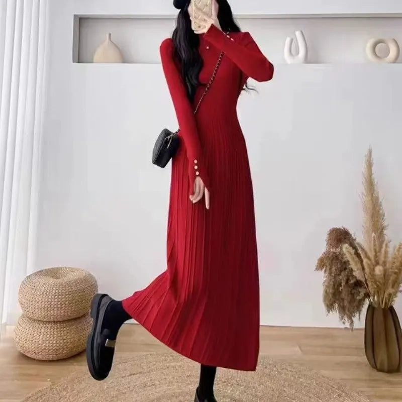 Women's high-waist knitted A-line skirt dress in a solid colour, mid-length below the knees.