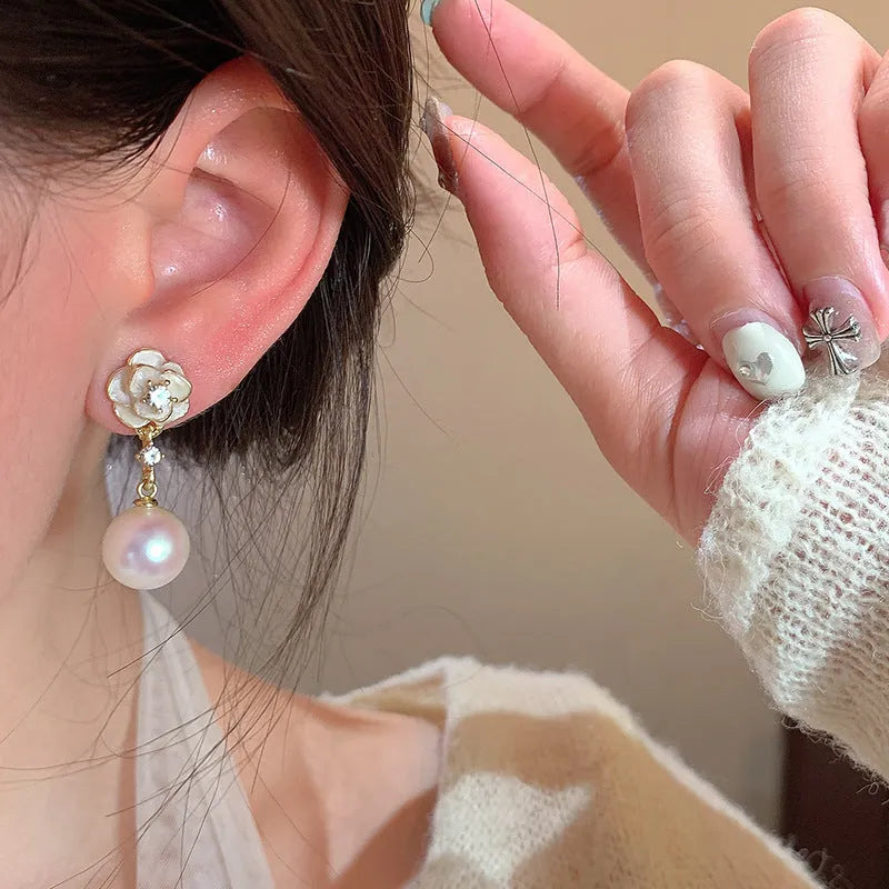 Women's camellia flower stud earrings with pearl accent on alloy base