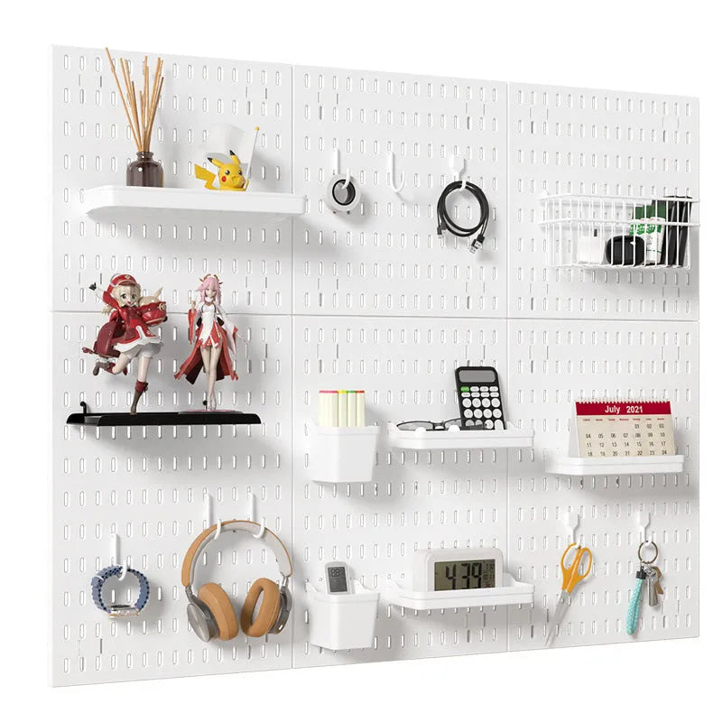 White punch-free plastic wire-wrap board storage rack mounted on a wall with hooks