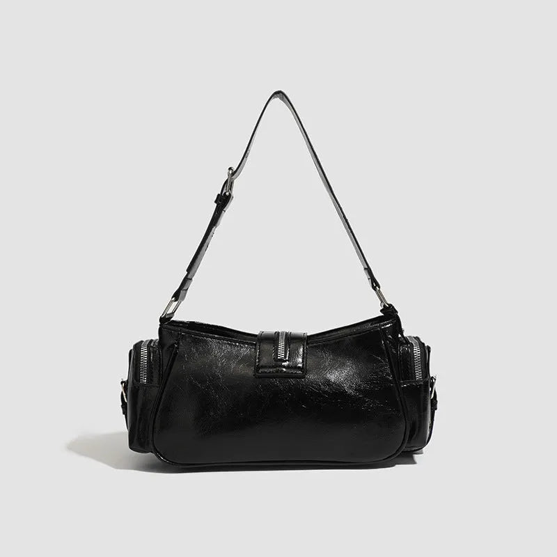 Black retro oil wax leather shoulder bag with dumpling shape and internal organisation pockets