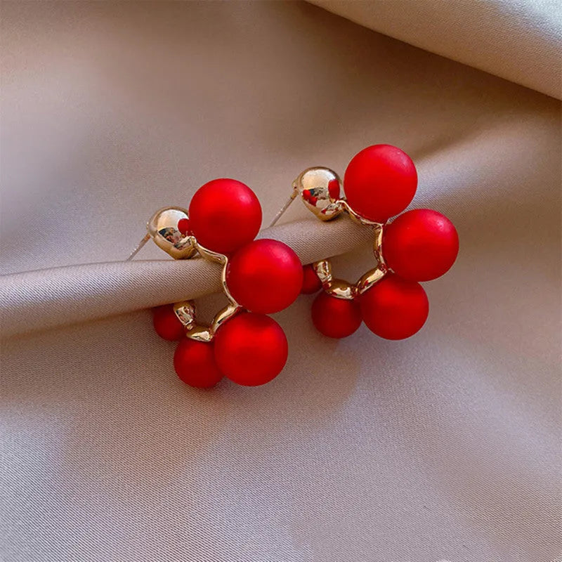 Round alloy bell drop earrings in red colour for pierced ears