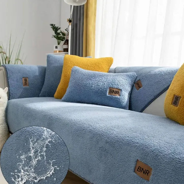 Lambswool sofa slipcover in solid blue colour on a grey sofa