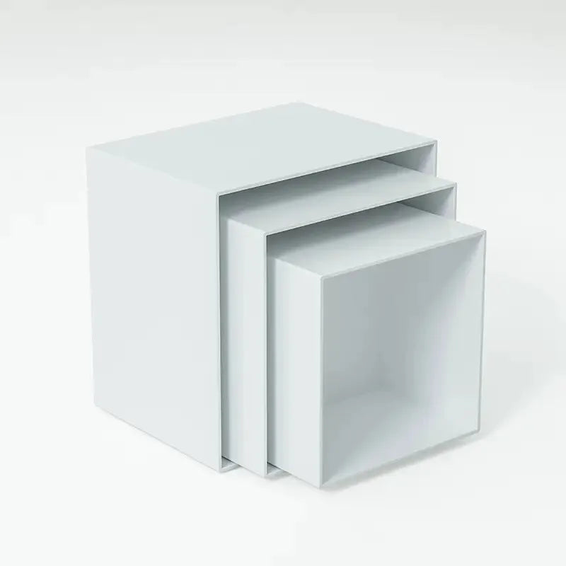 White plastic modular dessert display stand with six interlocking cubes for cake and pastry presentation