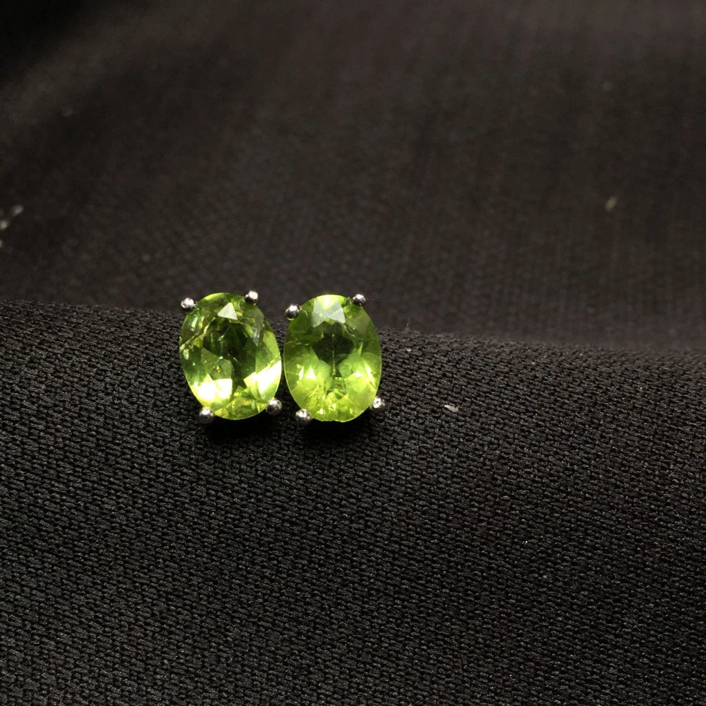 Grass green natural Olivine faceted stud earrings in S925 sterling silver settings.