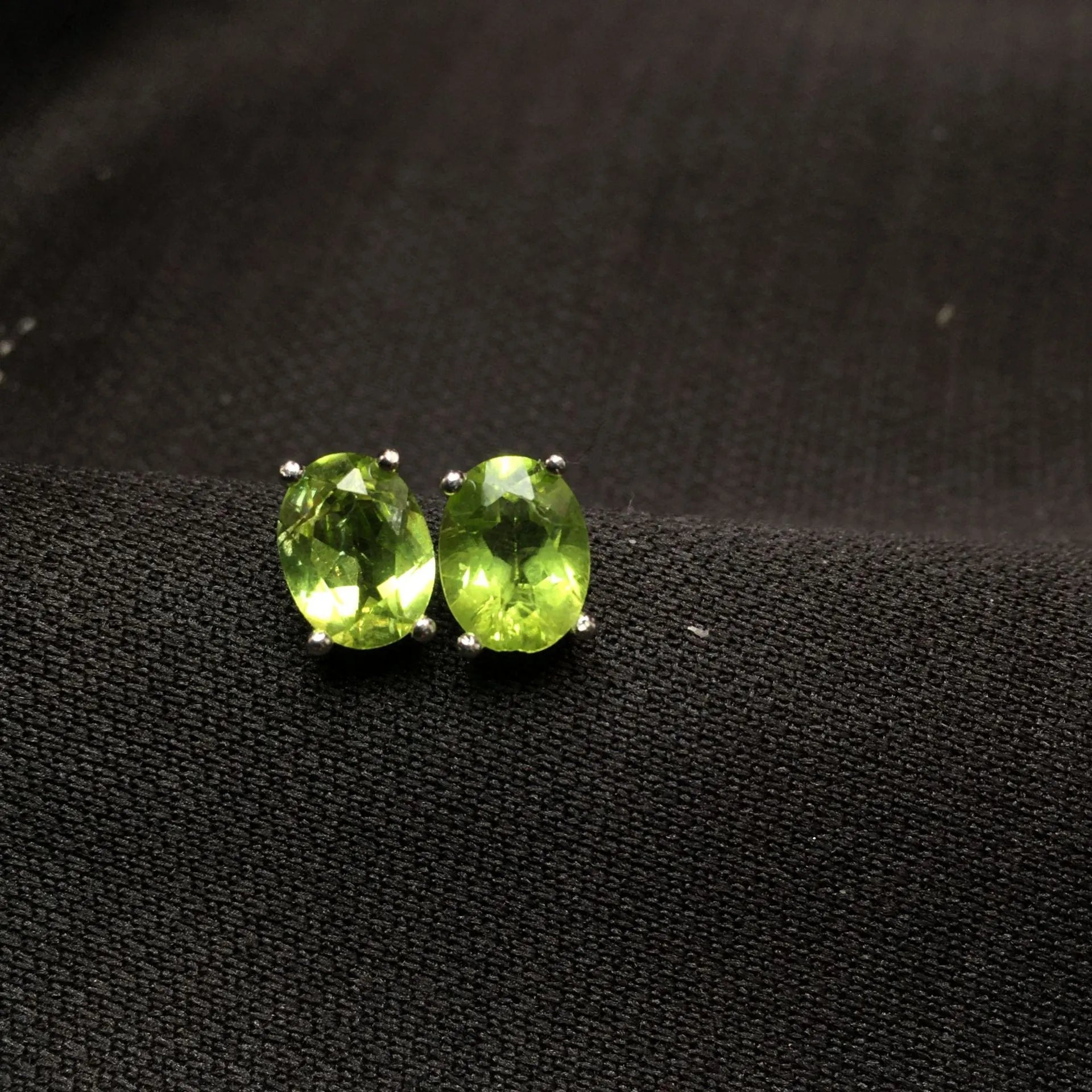 Grass green natural Olivine faceted stud earrings in S925 sterling silver settings.