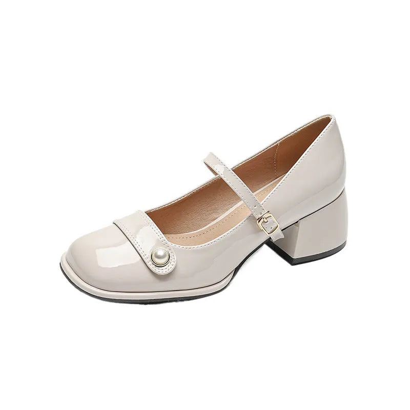 Women's apricot patent leather heel pumps with a chunky block heel and buckle fastening