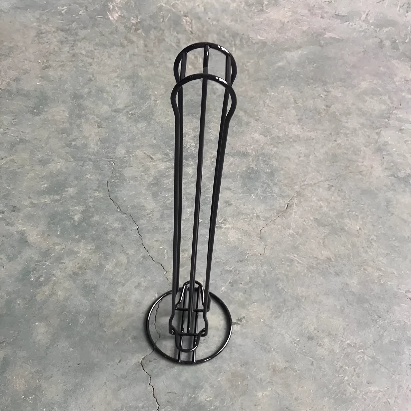 Wrought iron coffee capsule storage rack holding pods with black or silver finish