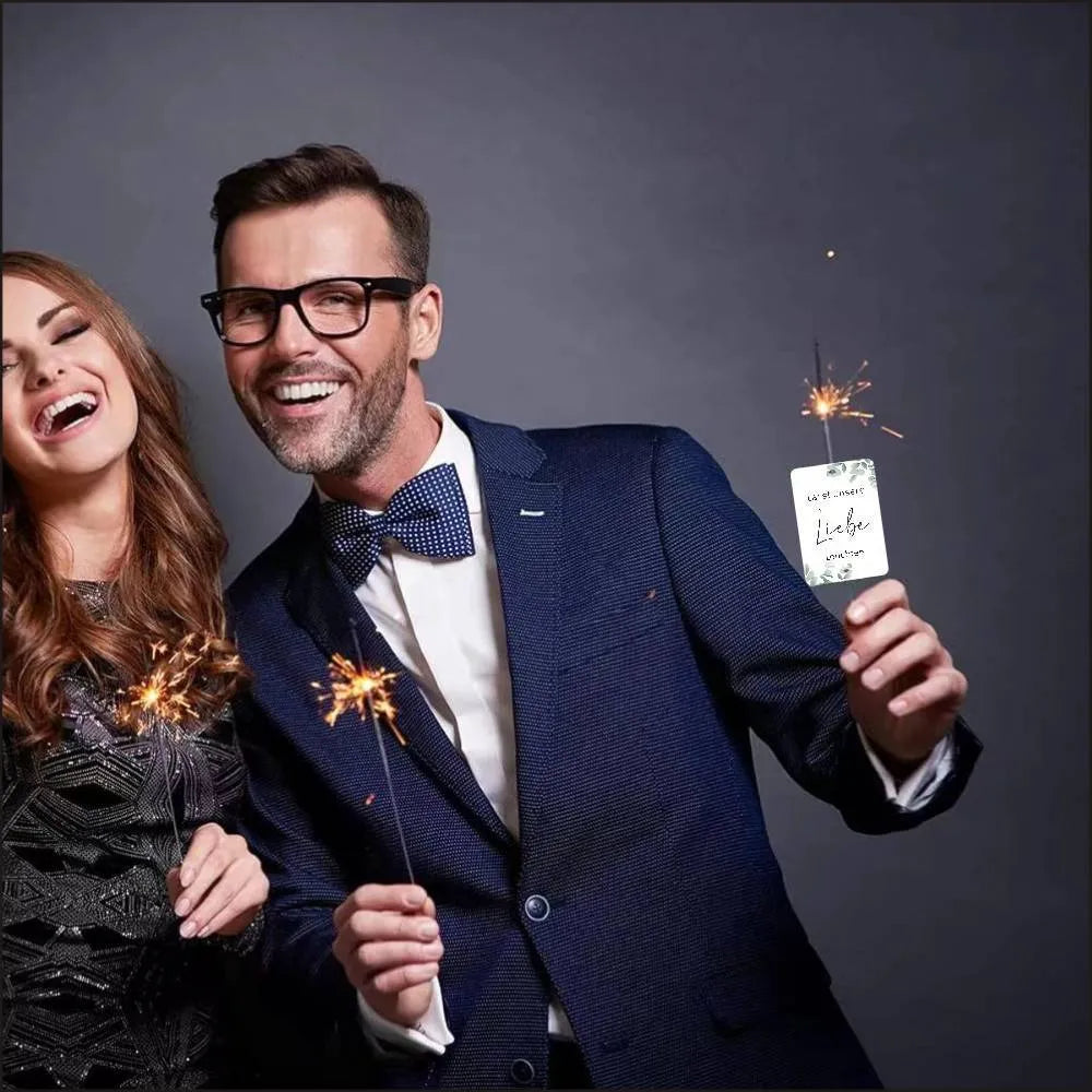 White decorative paper labels with fireworks design and I Make Love sparkling text