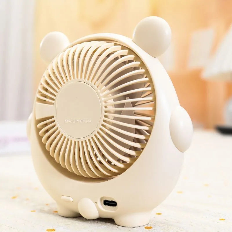 Cute dog-themed USB desktop electric fan on a desk, showing brown puppy colour variant.