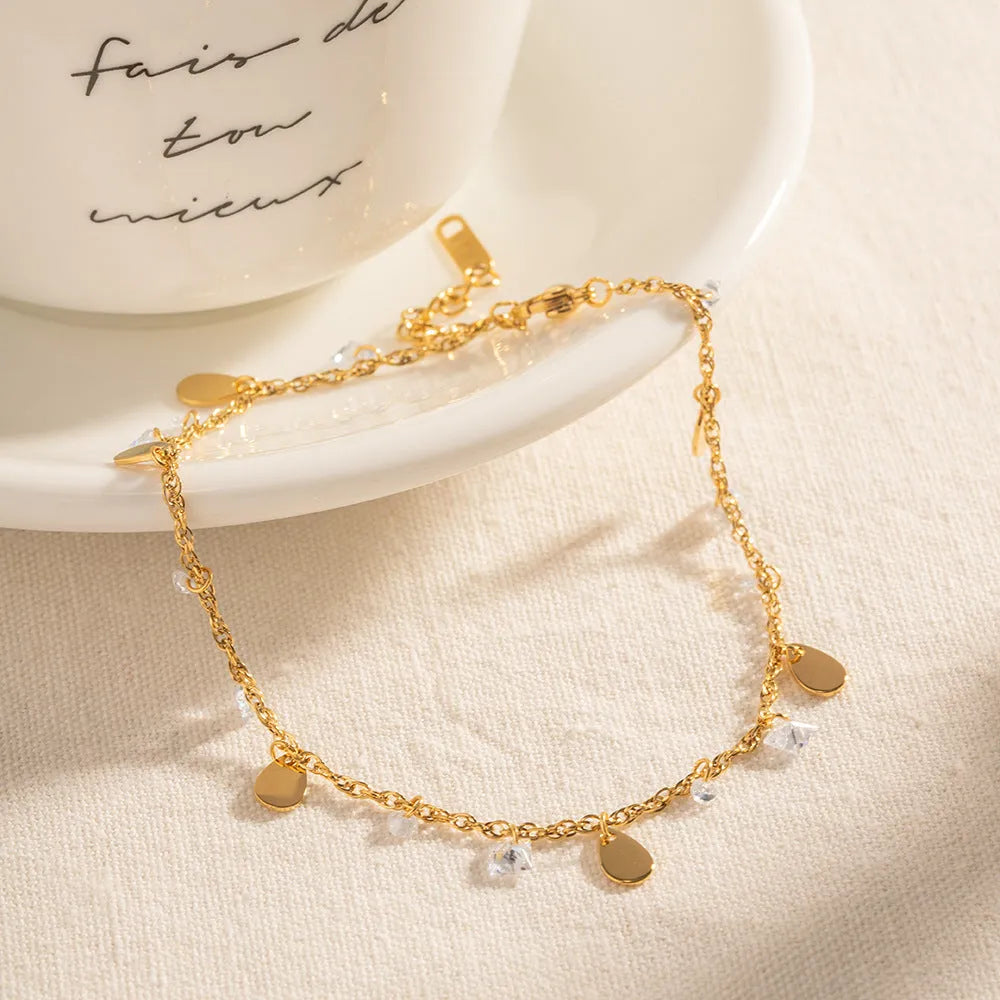 Women's stainless steel anklet with geometric water drop tassel design in silver.