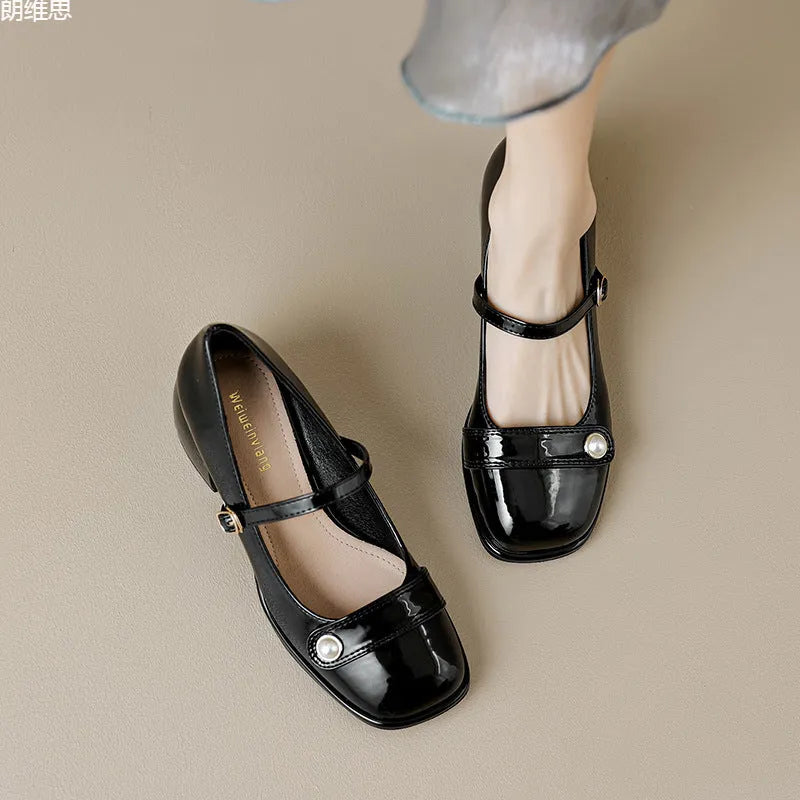 Women's apricot patent leather heel pumps with a chunky block heel and buckle fastening