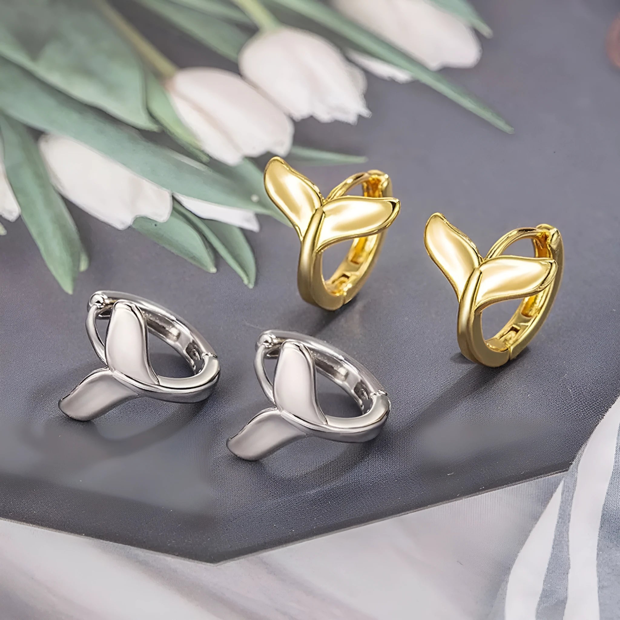Women's fashion fishtail earrings in copper with electroplated white gold and yellow gold finishes