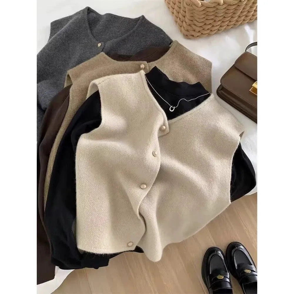 Women's polyester pullover vest with half sleeves in smoky grey, available in medium and large sizes by weight