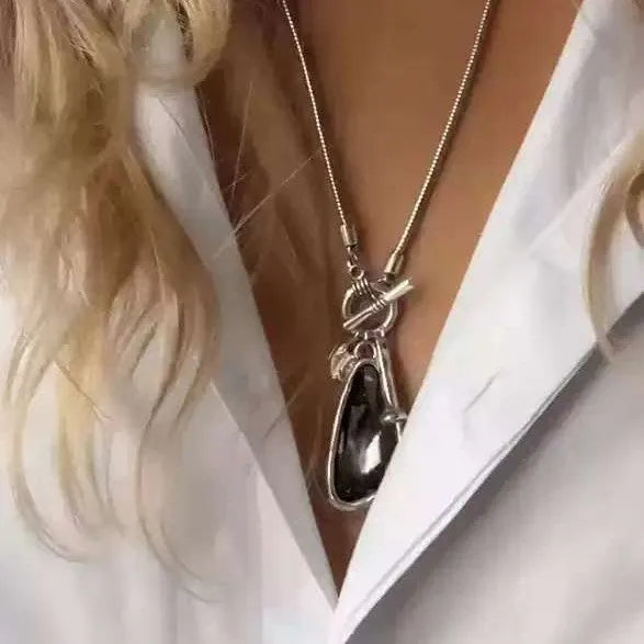 Women's long necklace with geometric pendant on snake bones chain in blue water drop finish