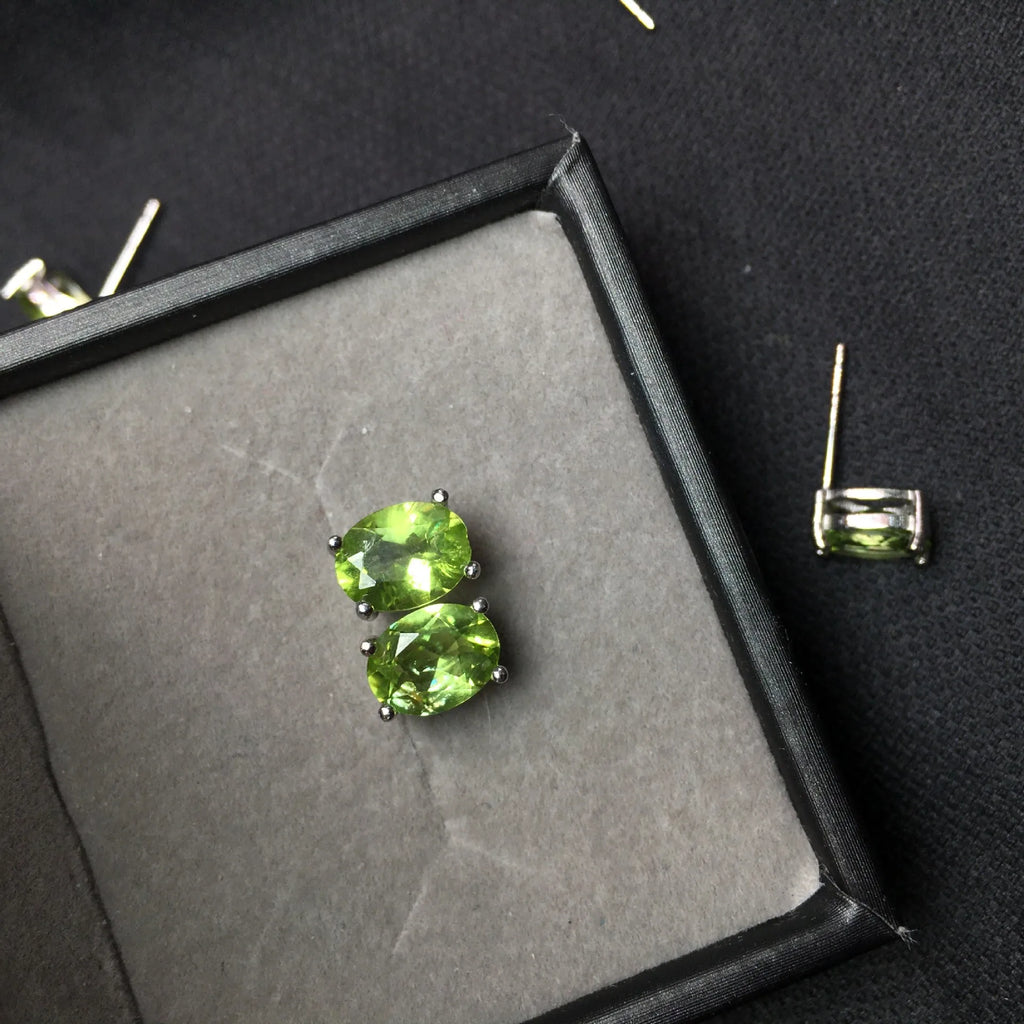 Grass green natural Olivine faceted stud earrings in S925 sterling silver settings.