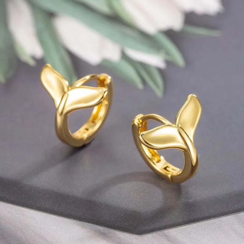 Women's fashion fishtail earrings in copper with electroplated white gold and yellow gold finishes