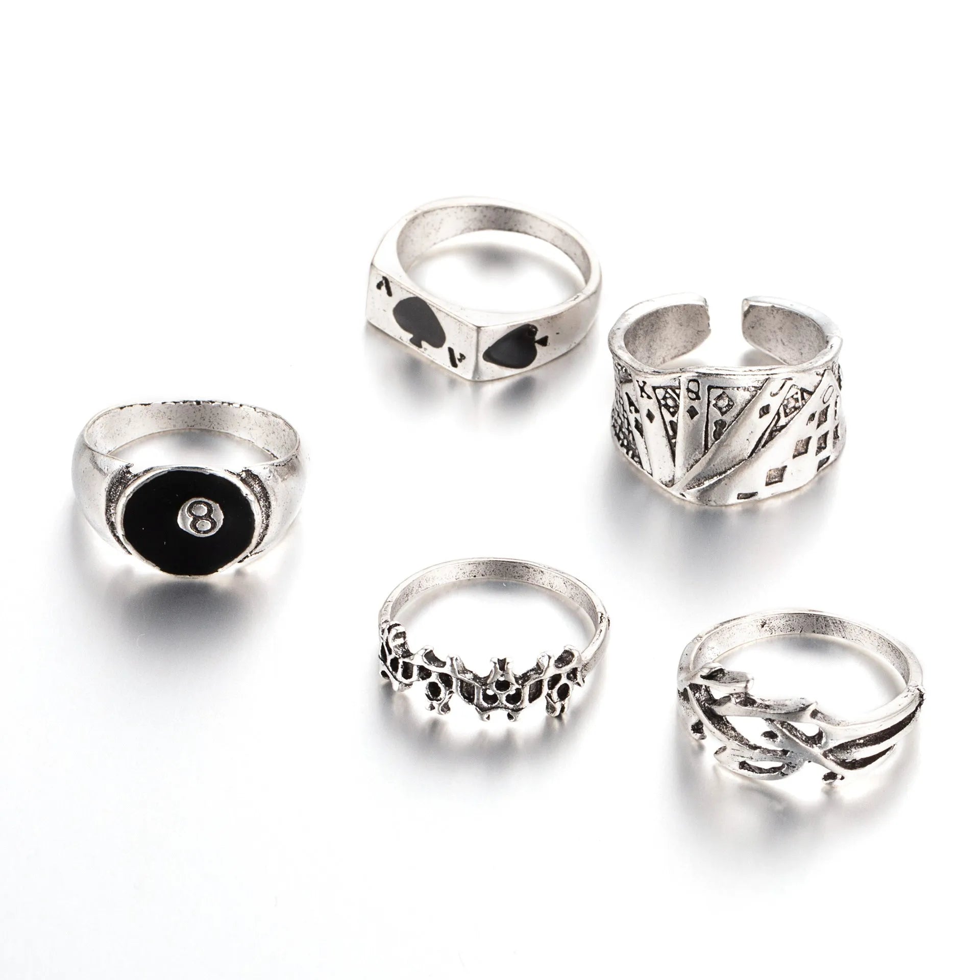 Black alloy poker ring with a detailed retro spade design on a female model's hand.