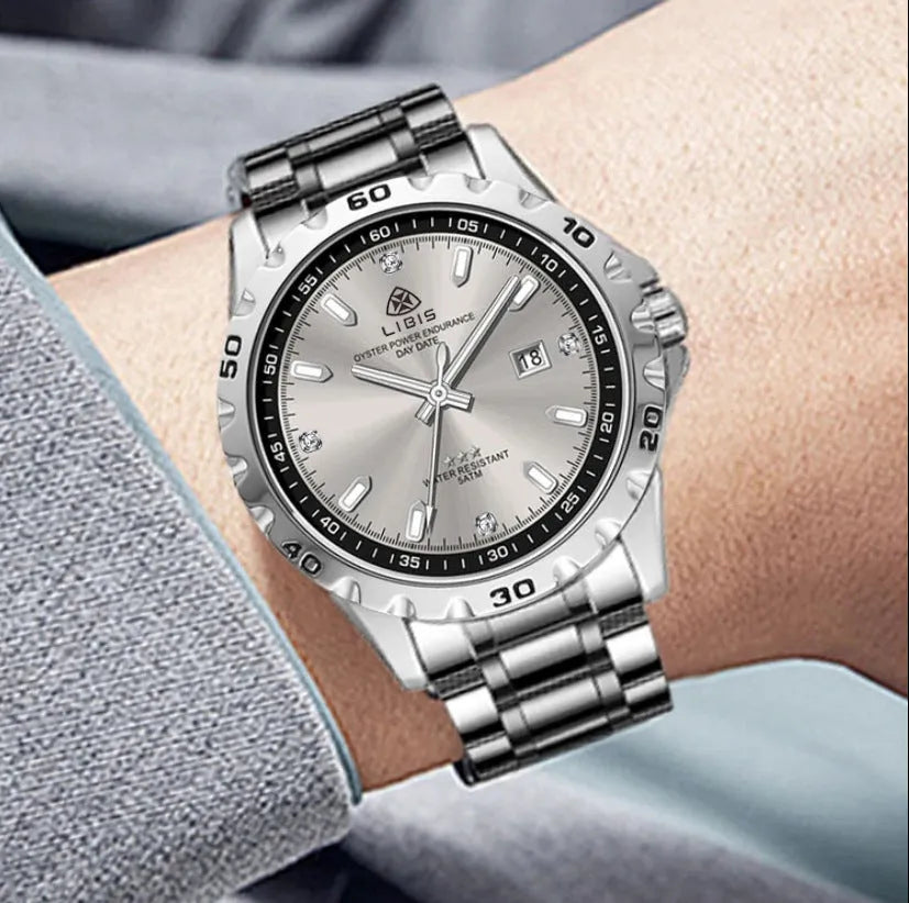 Men's silver case business watch with luminous hands, stainless steel strap, and sapphire glass