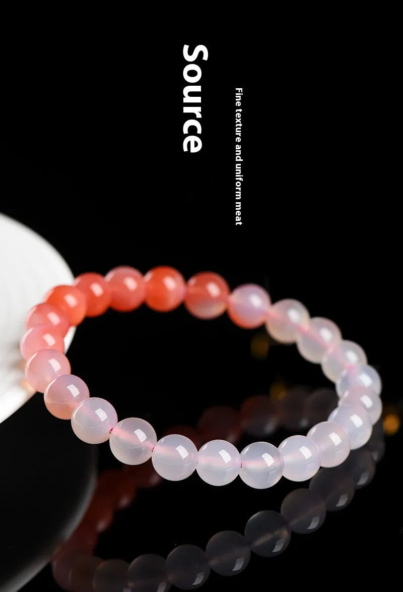Natural gradient Yanyuan agate bracelet with geometric beads in salt source colour on a white background