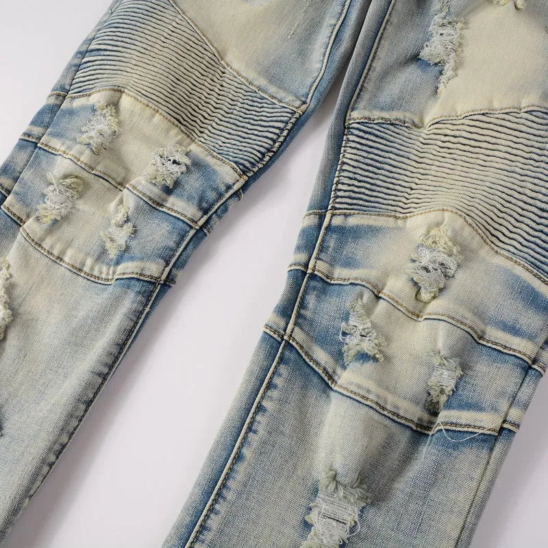Light blue men's slim fit distressed jeans with hand-frayed detailing on a mid waist.