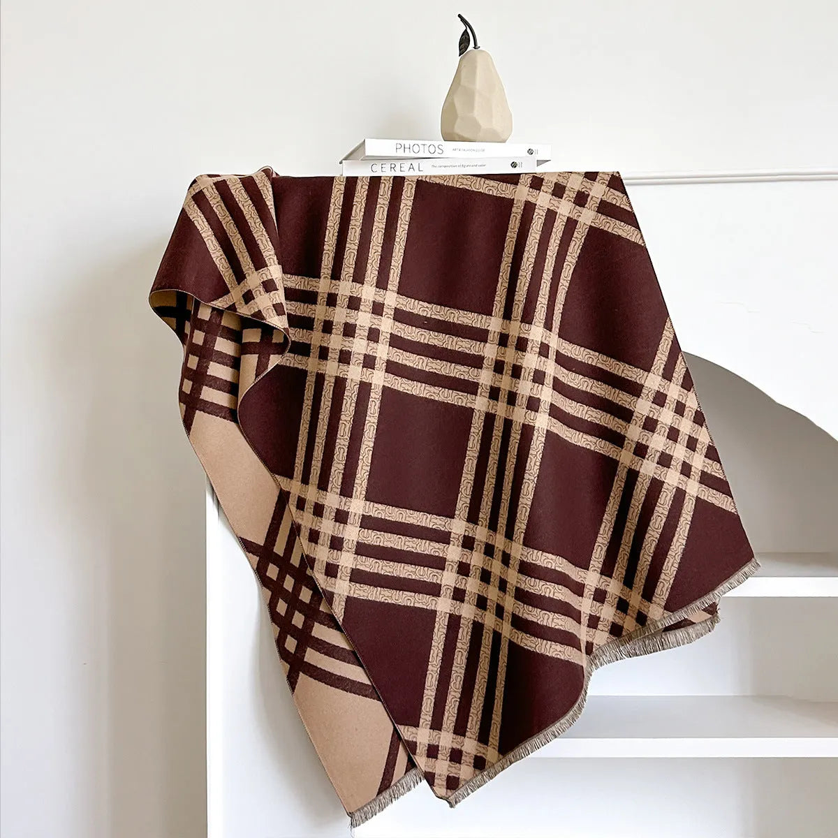 Cashmere-like scarf with tassel detailing in brown colour showing mid-length design
