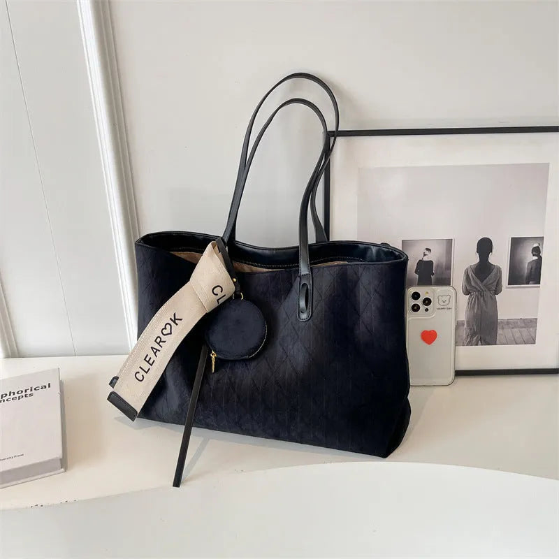 Soft polyester large tote shoulder bag in a horizontal square shape with an external pocket.