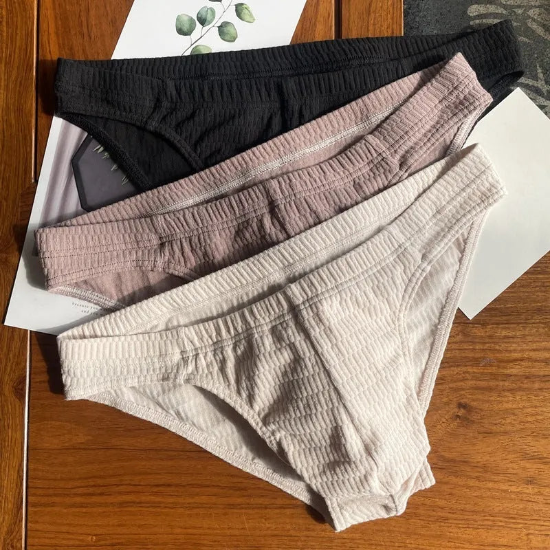 Men's cotton briefs in solid colours showing mid waist and triangle design