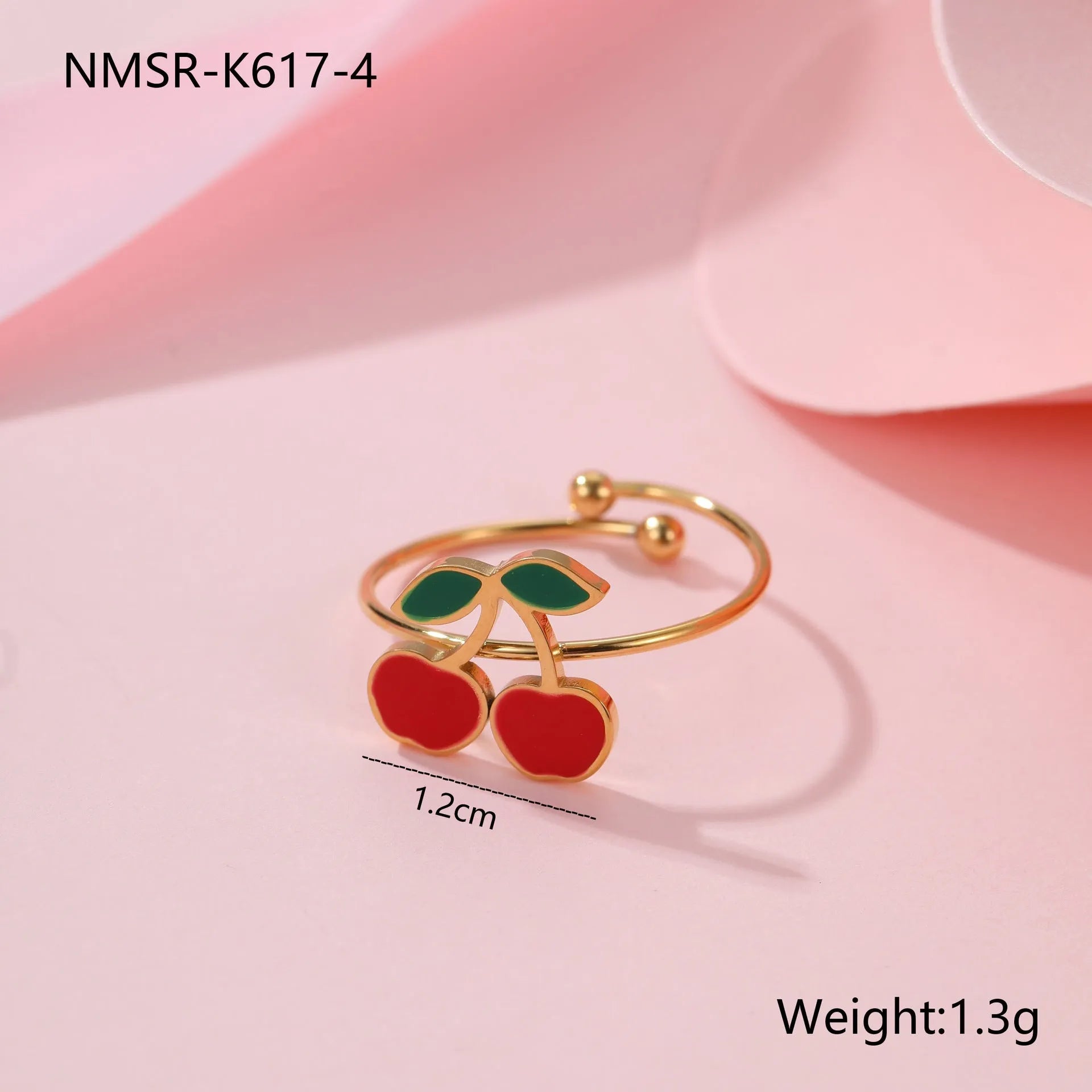 Cherry jewellery set showing necklace, bracelet, earrings, and ring in stainless steel with 18K electroplated finish