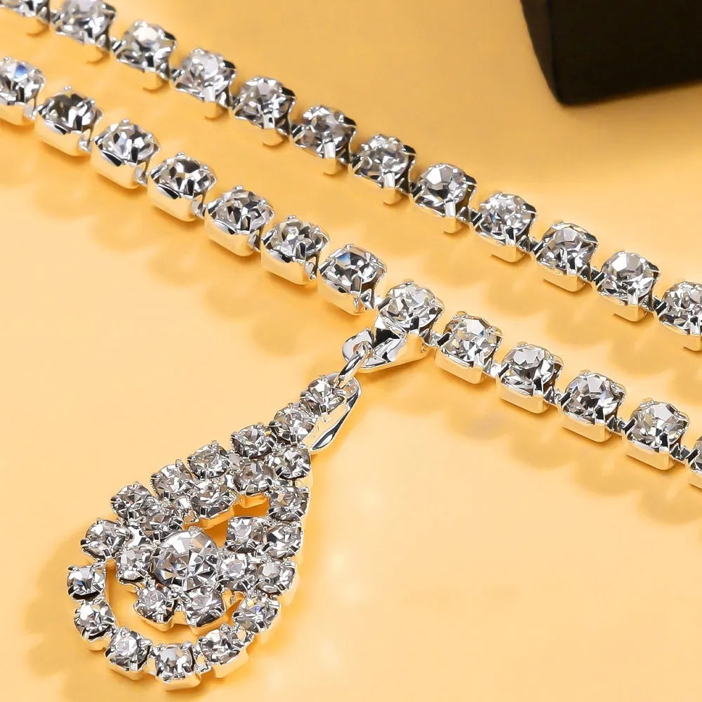 Gold or silver women's waist chain with water drop pendant measuring 115cm length with lobster buckle closure