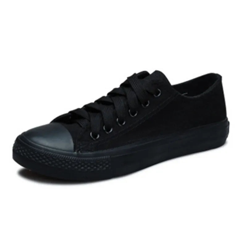 Women's solid colour casual canvas shoes in lace-up style on a white background.