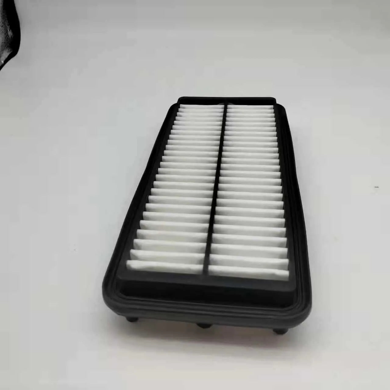 Black rectangular car air filter measuring 256mm by 113mm by 40mm