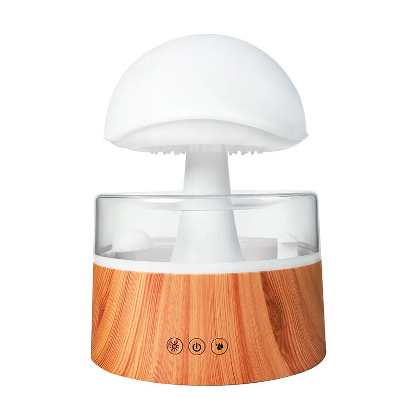 White rain cloud shaped ultrasonic humidifier and aroma diffuser with LED lighting showing rainfall simulation effect