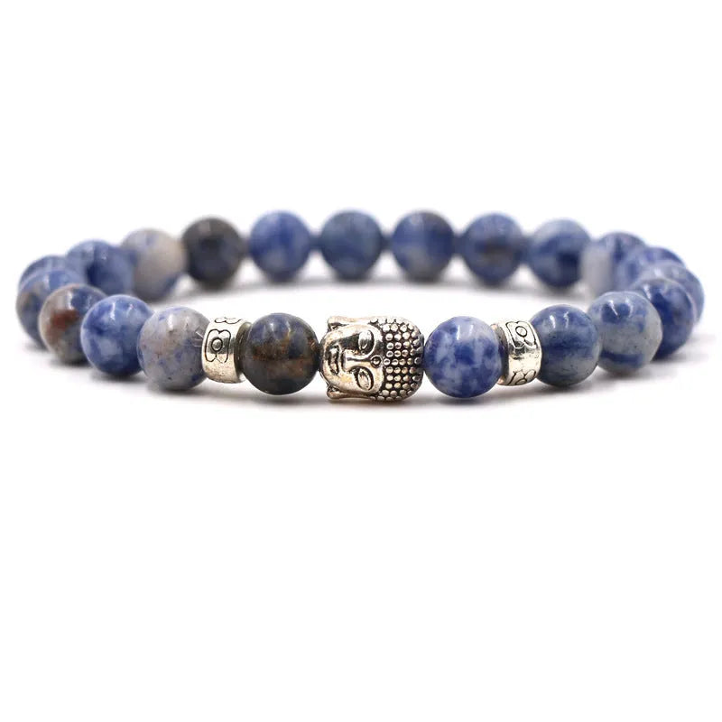 Tigereye stone Buddha head stretch bracelet with 8mm beads on a wrist.