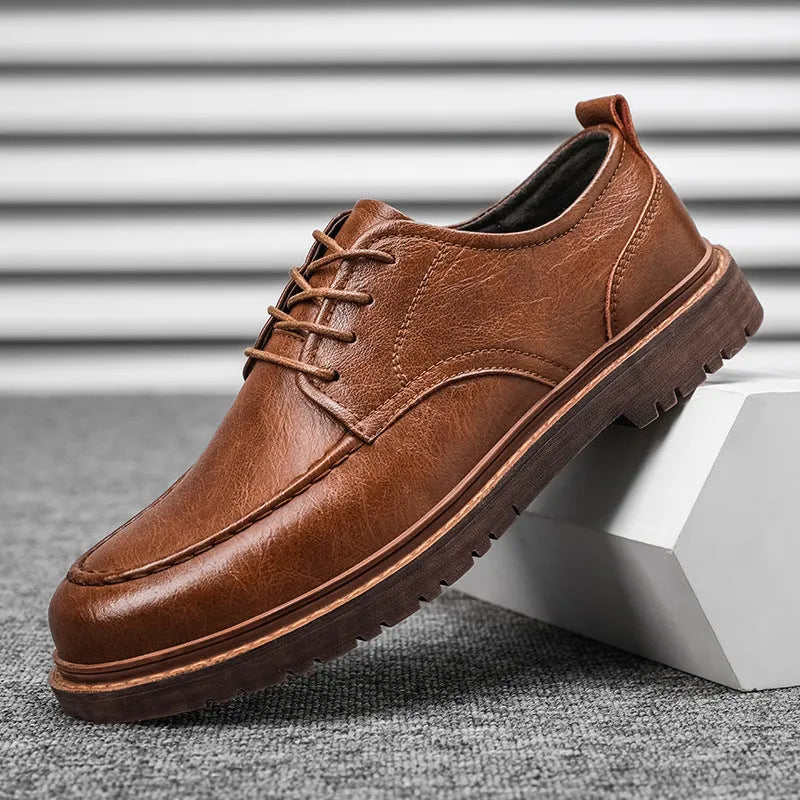 Men's black and brown casual leather shoes with round toe and flat rubber sole.