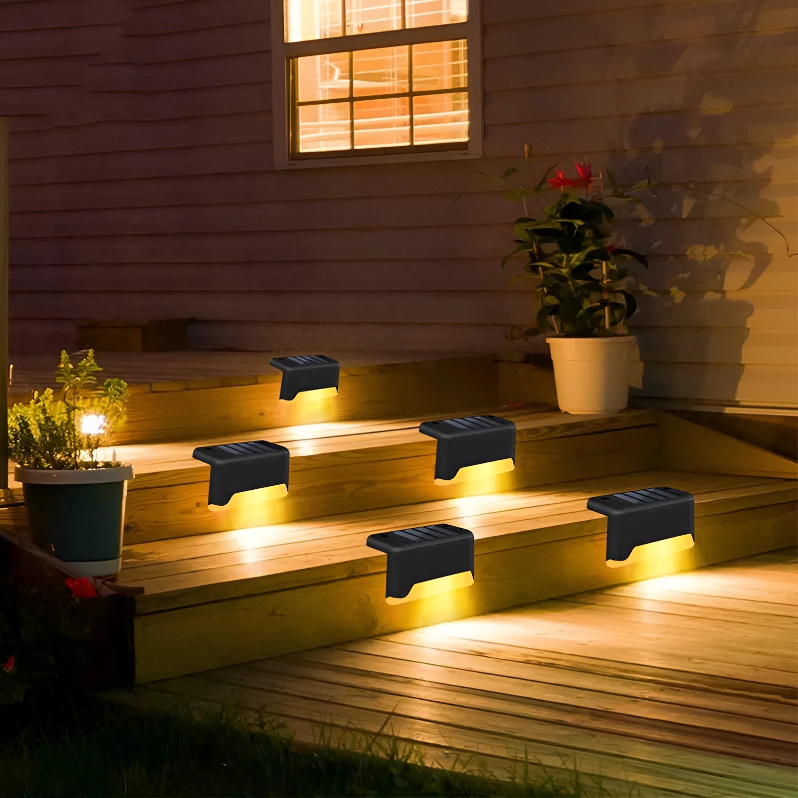 black solar courtyard stair light with ABS body on a garden step