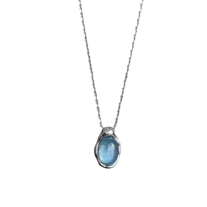 Women's navy blue water drop pendant necklace on adjustable copper cross chain